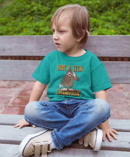 sad kid wearing a tshirt mockup sitting on a bench a17954 (teal)