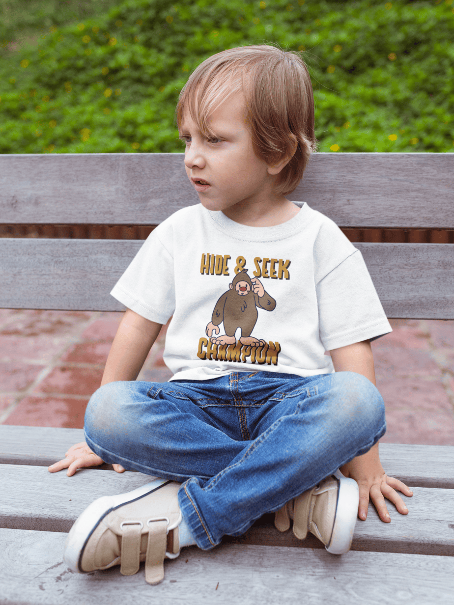sad kid wearing a tshirt mockup sitting on a bench a17954( white )