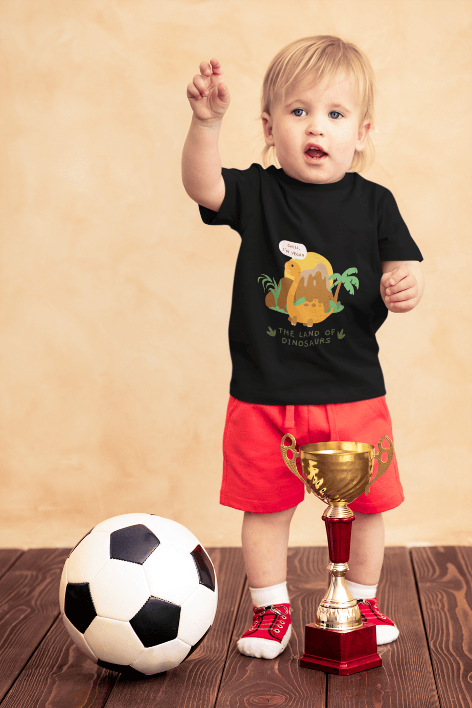 t shirt mockup of a little boy with a soccer ball and a trophy 43081 r el2 (1)