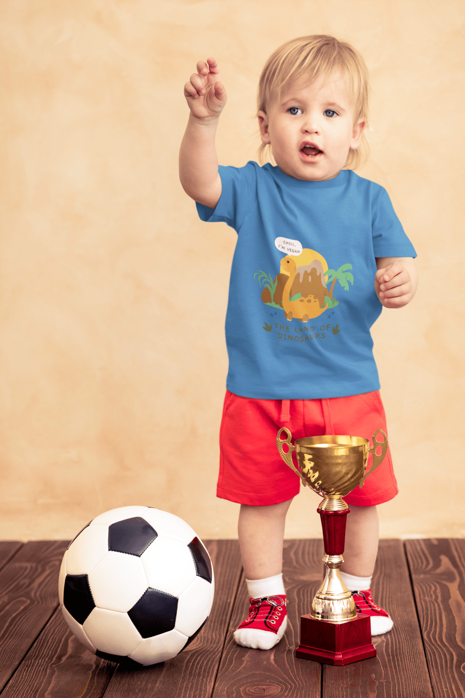 t shirt mockup of a little boy with a soccer ball and a trophy 43081 r el2 (2)