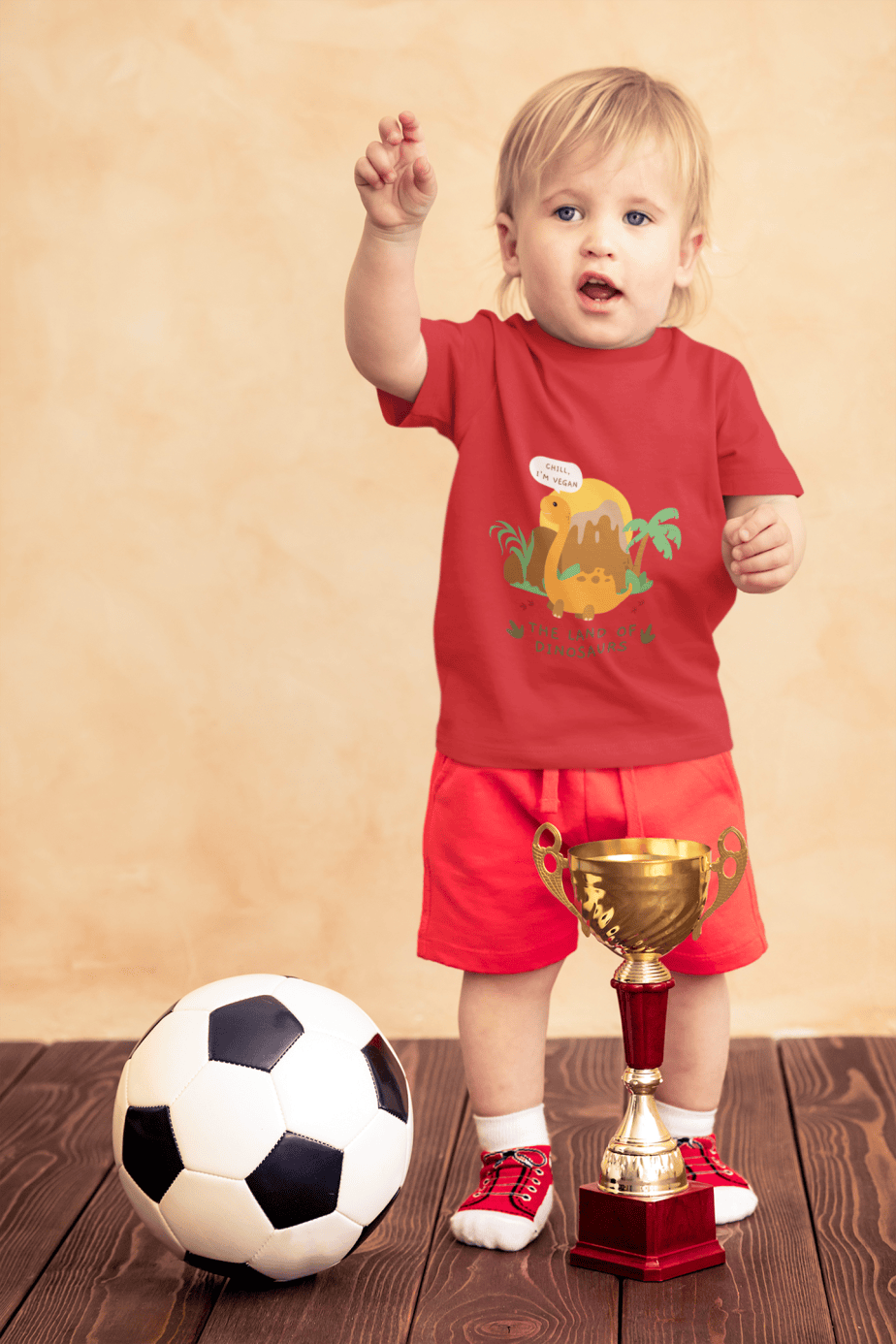 t shirt mockup of a little boy with a soccer ball and a trophy 43081 r el2 (3)