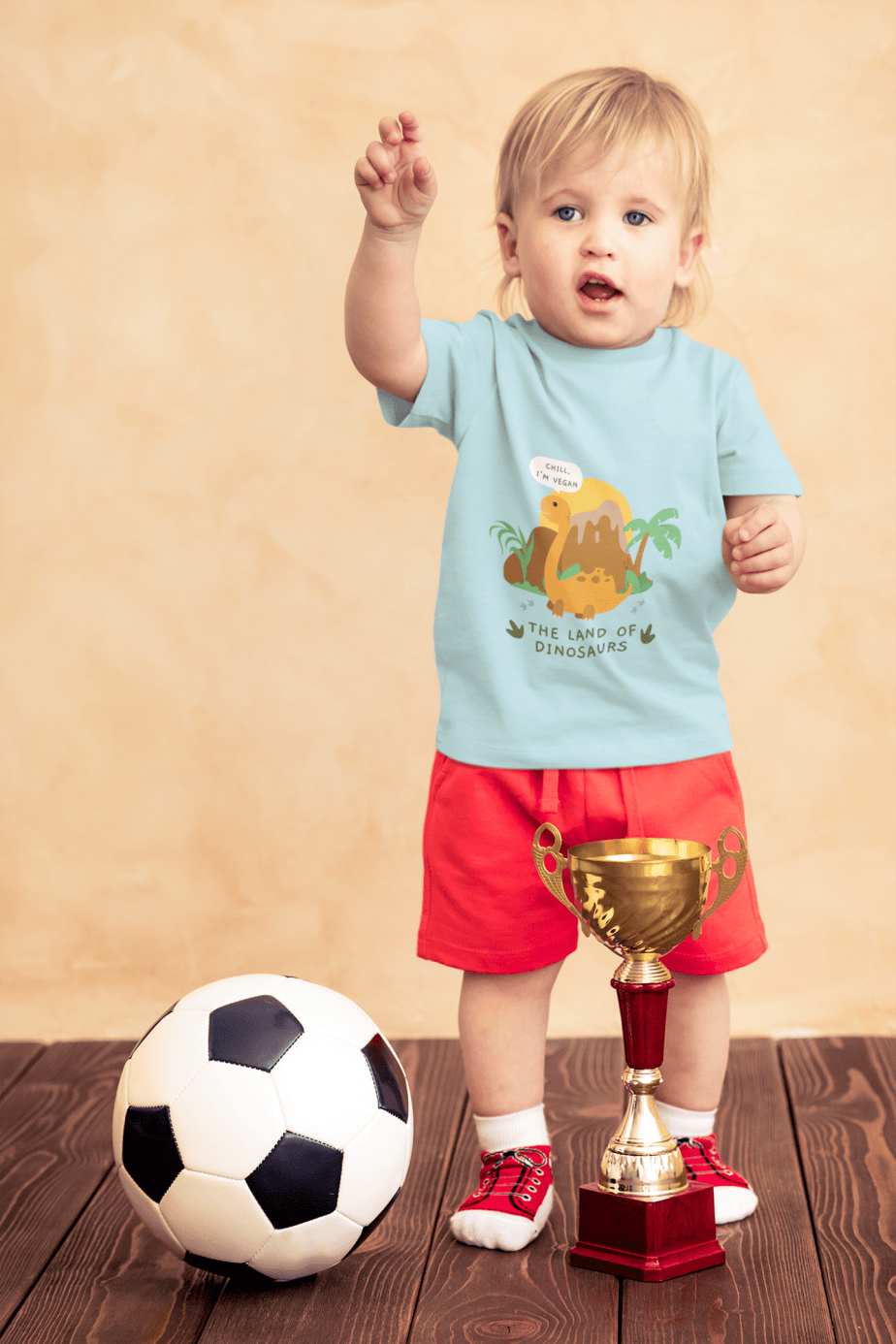 t shirt mockup of a little boy with a soccer ball and a trophy 43081 r el2 (4)