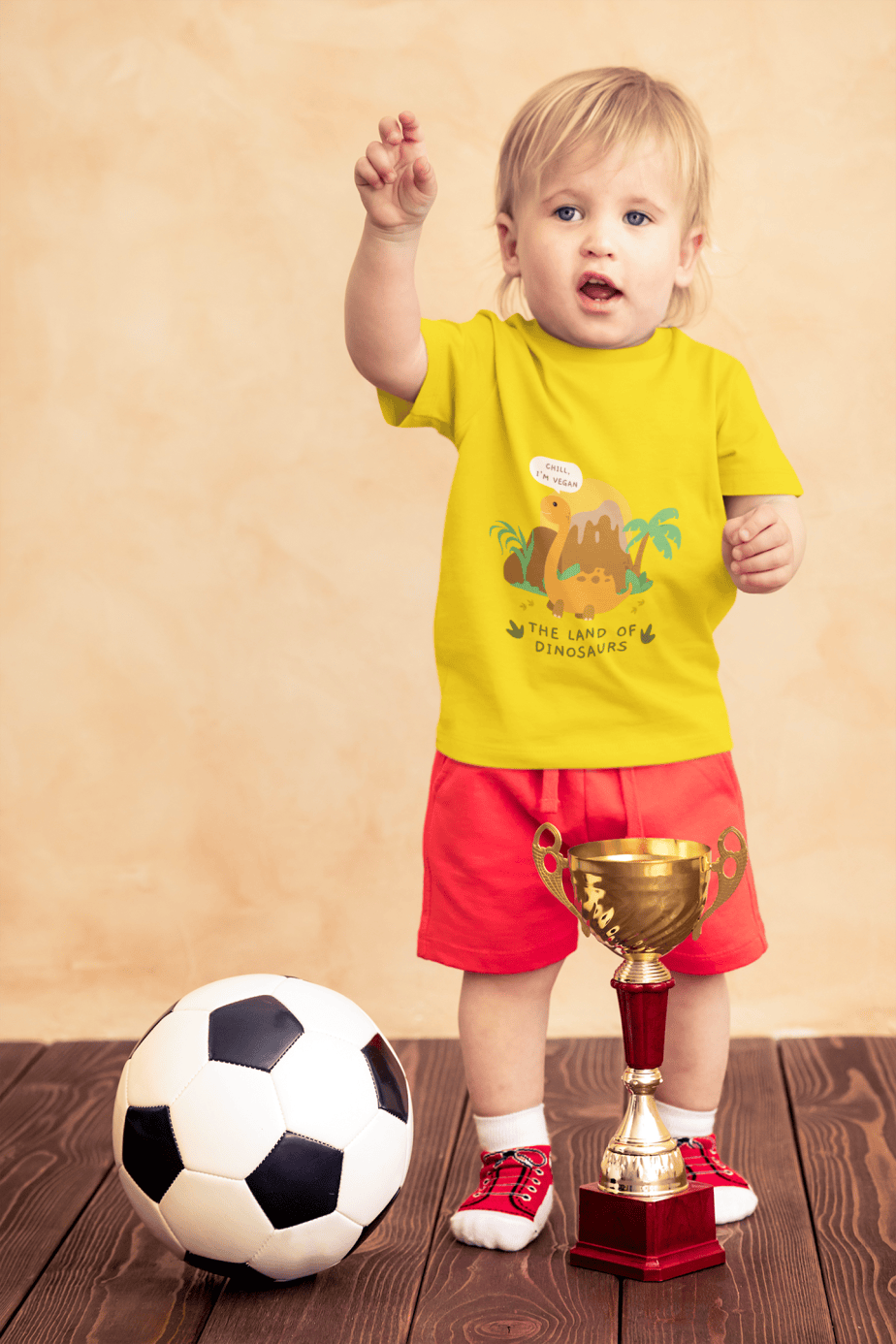 t shirt mockup of a little boy with a soccer ball and a trophy 43081 r el2 (8)