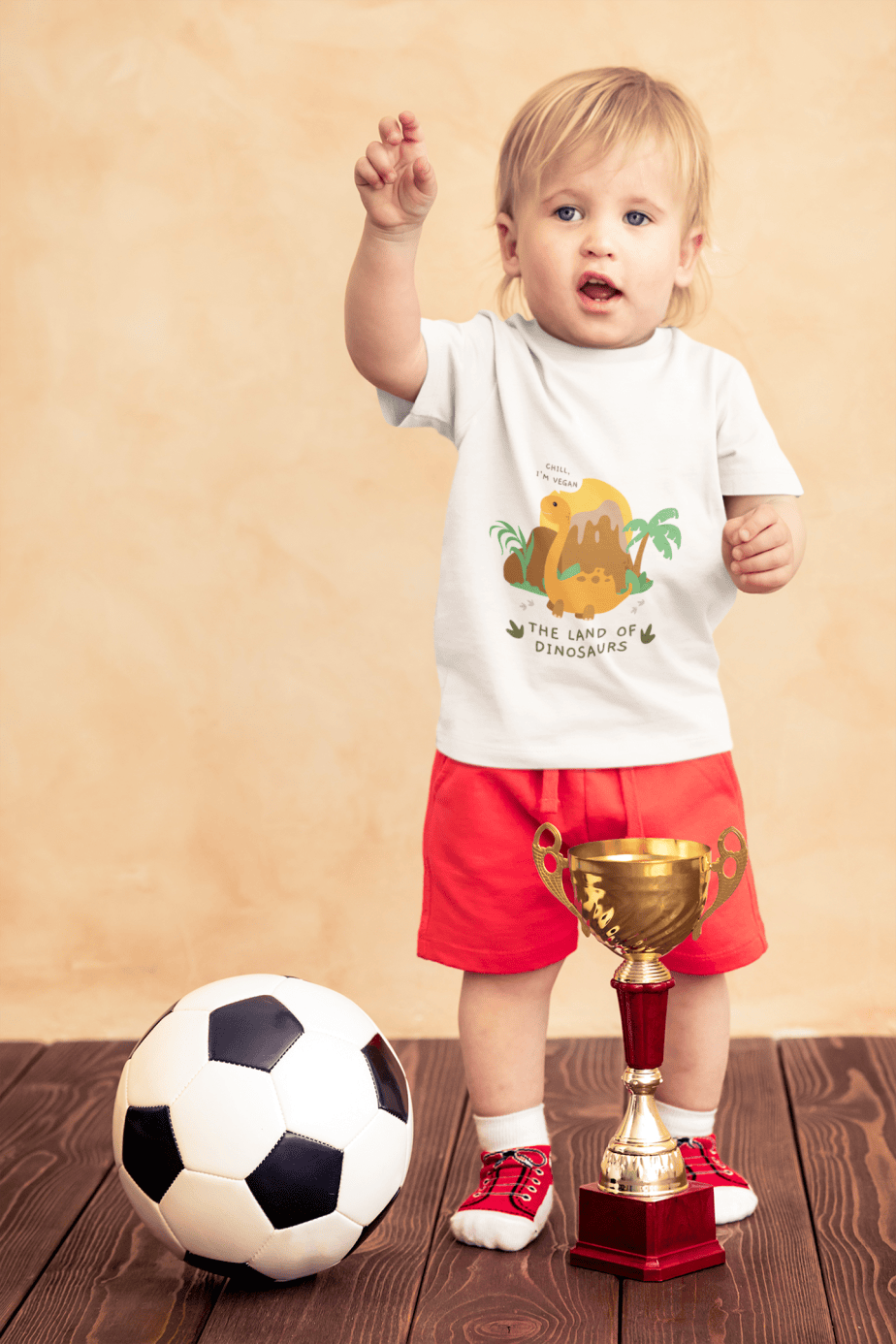 t shirt mockup of a little boy with a soccer ball and a trophy 43081 r el2