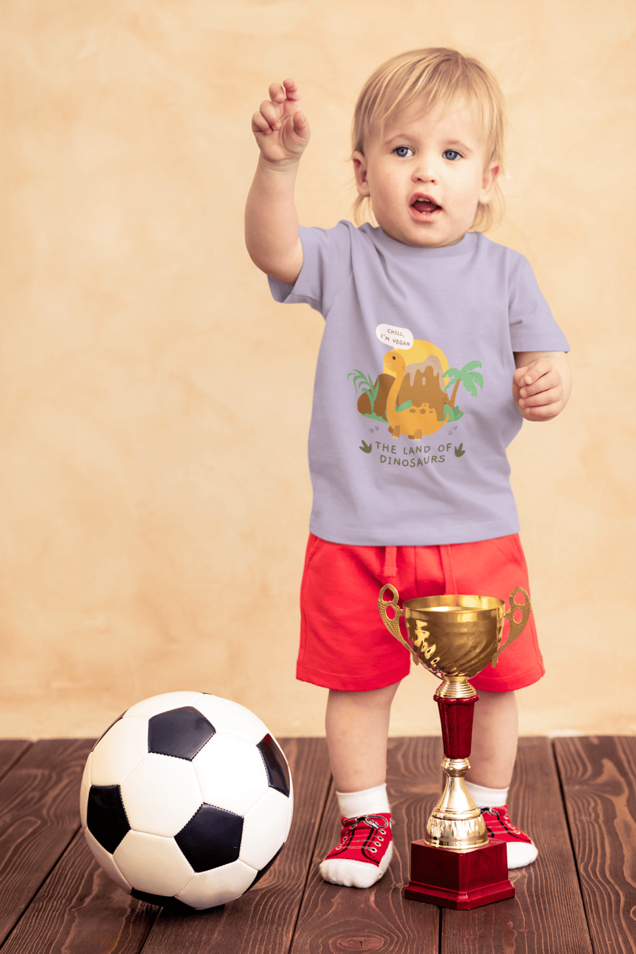 t shirt mockup of a little boy with a soccer ball and a trophy 43081 r el2l